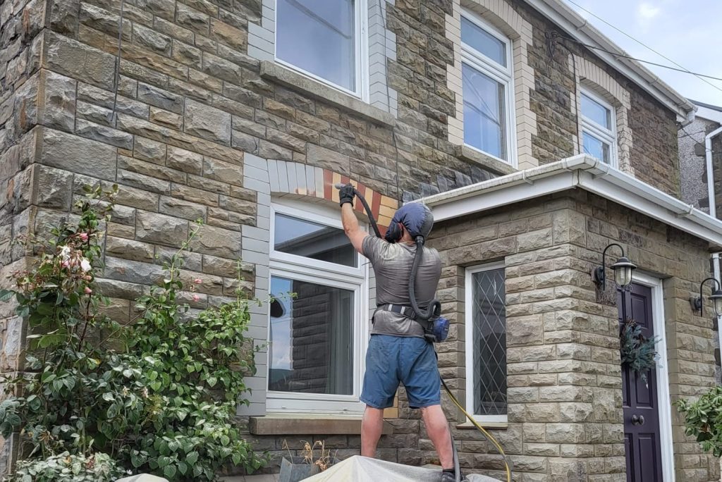 Sandblasting to remove paint