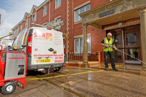 STR Cleaning Services, using a DOFF machine to clean a block of flats in Neath, Wales, UK